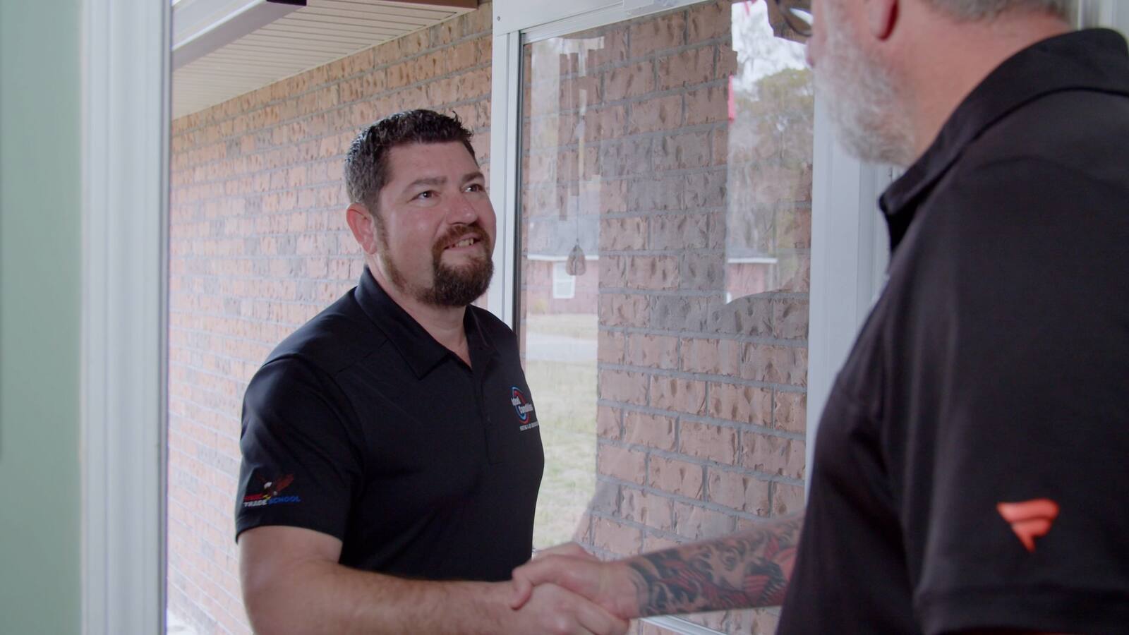 Ideal Conditions technician greeting a homeowner at the door