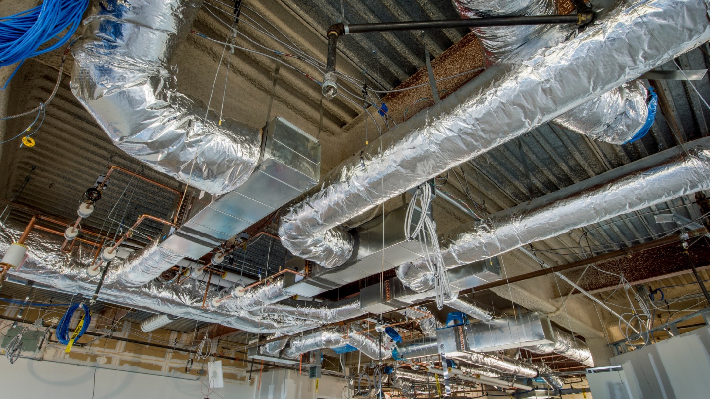 Ideal Conditions crew sealing ductwork for a Jacksonville home