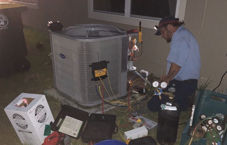 Ideal Conditions technician on a 24/7 emergency AC repair in Jacksonville