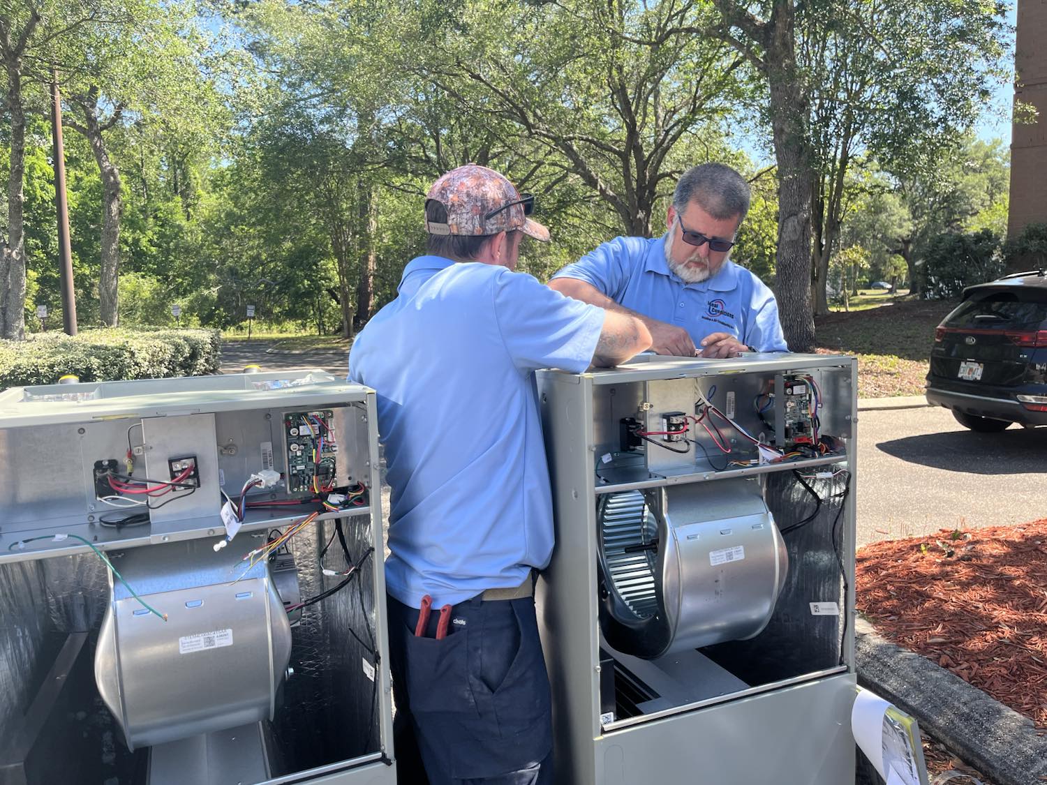 Ideal Conditions technicians preparing new high-efficiency heat pump air handlers for a Jacksonville install