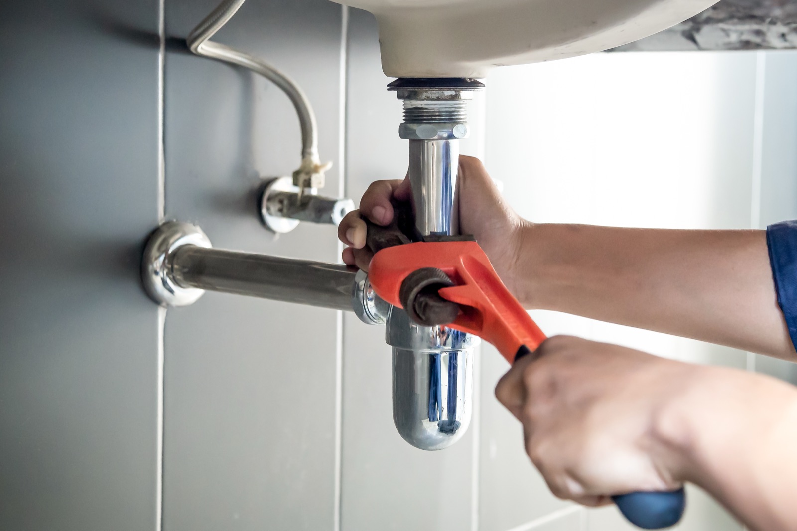 Licensed Ideal Conditions plumber working on residential pipework in Jacksonville, FL