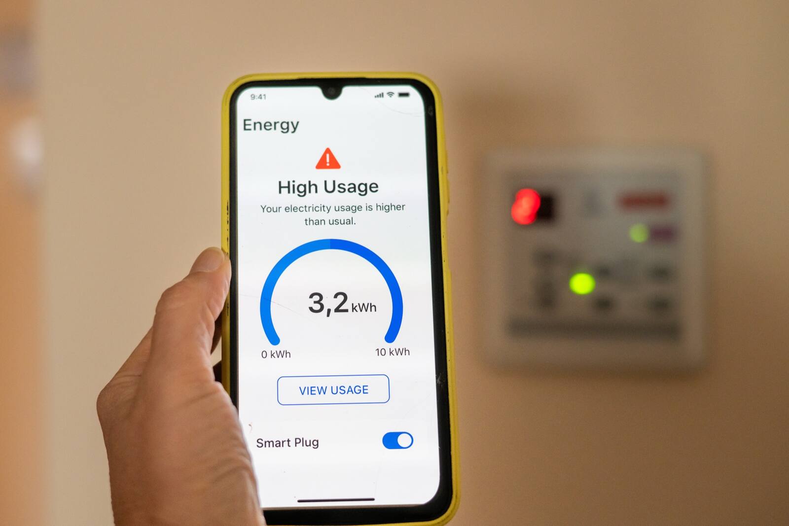 Smartphone energy app showing a 'High Usage' electricity alert in a Jacksonville home