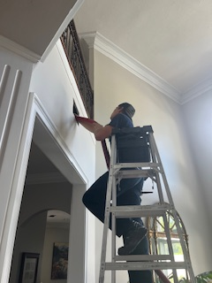 Cleaning Duct in Jacksonville FL on Ladder